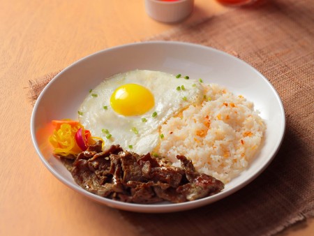 a dish of Classic Tapa King with fried egg, tapa, fried rice, and atchara