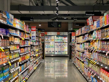 a supermarket aisle with rows of brands competing for attention