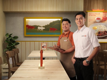 A waiter and restaurant manager proudly wearing the new Tapa King uniforms inside the store. art directed and photographed by Bluethumb